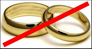 rings off but together indicating possible happy divorce proceedings